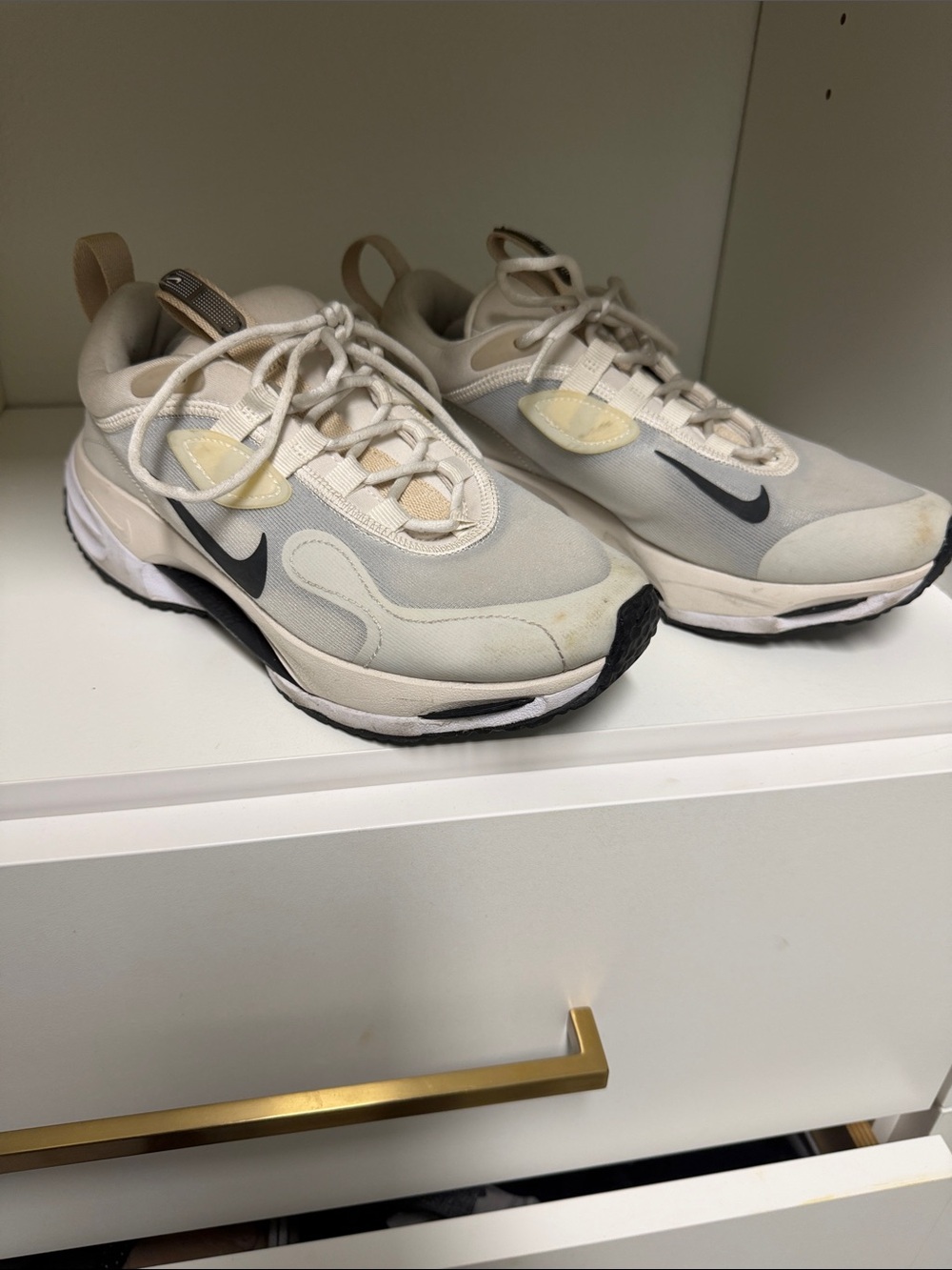 Nike Womenโs Cream and Black Athletic Sneakers